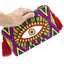 Pochette Clutch Wayuu Brodée Motif Oeil Rouge Jaune et Vert Pochettes Brodées Soleico Fait main motif Evil Eye. Artisanat Ethnique Responsable. Modèle similaire Enayim design Sac Colombien