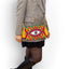 Pochette Soleico Clutch Wayuu avec Motif Oeil brodé Mauve Vert. Fait main motif Evil Eye. Artisanat Ethnique Responsable. Modèle similaire Enayim design Sac Colombien
